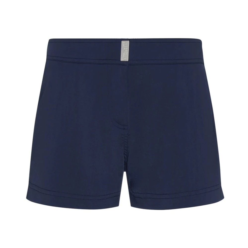 Solid blue swim shorts for women by Vilebrequin, featuring a shorty cut, elastic waistband, and a subtle logo tag at the back, made from quick-drying material in size XS.