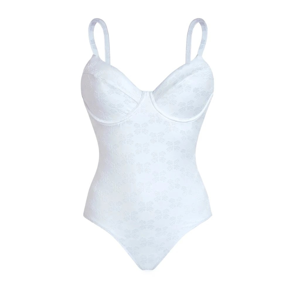 White one-piece swimsuit by Vilebrequin, featuring a structured bodice with cups, thin adjustable straps, and a subtle embossed pattern throughout.