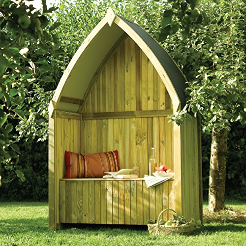 Natural wood arbour with a pointed roof, featuring a cozy bench, colorful cushions, and a small table, surrounded by greenery.