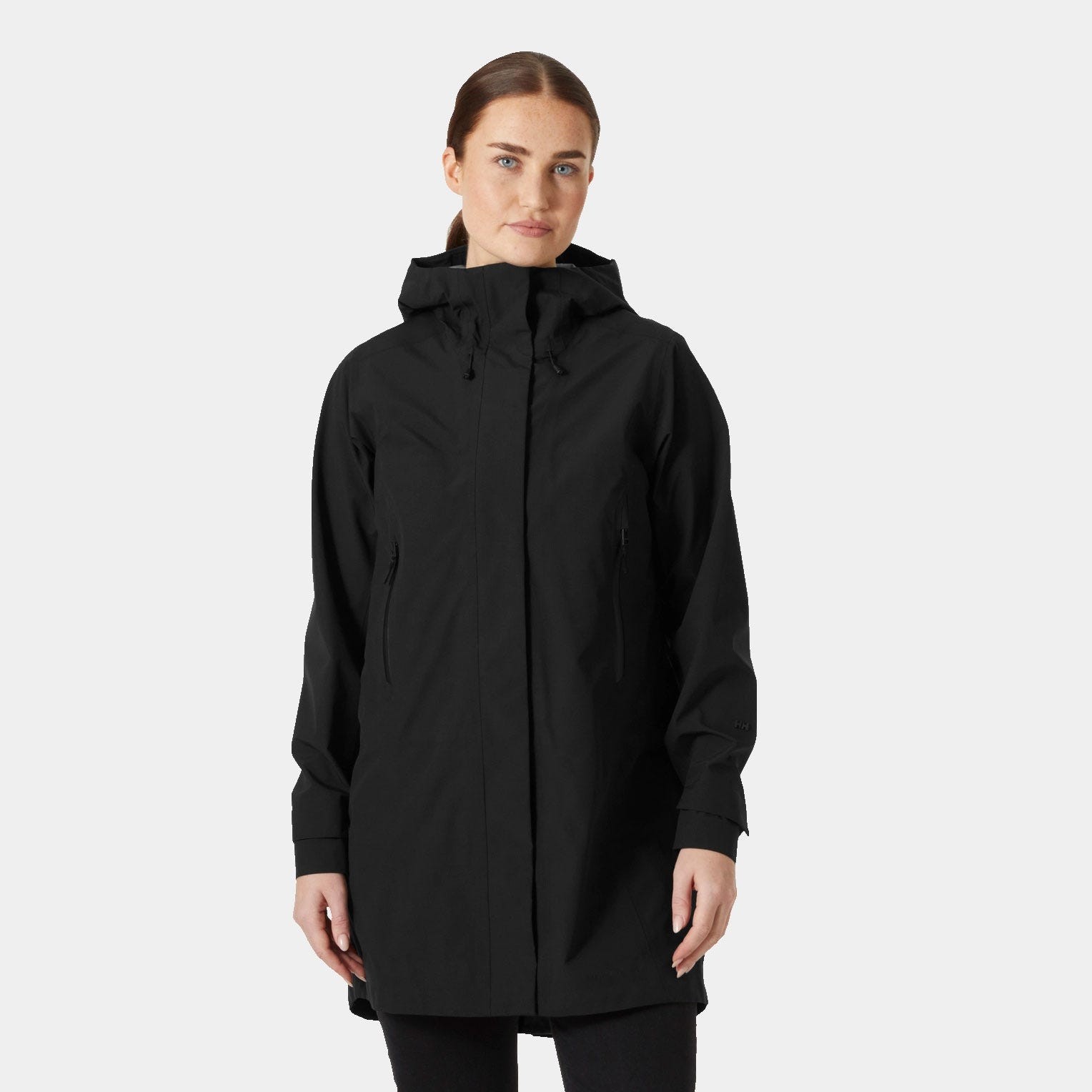 Women's black 3-in-1 hooded raincoat by Helly Hansen, featuring a sleek design, adjustable hood, and zippered pockets, made from lightweight, waterproof material.