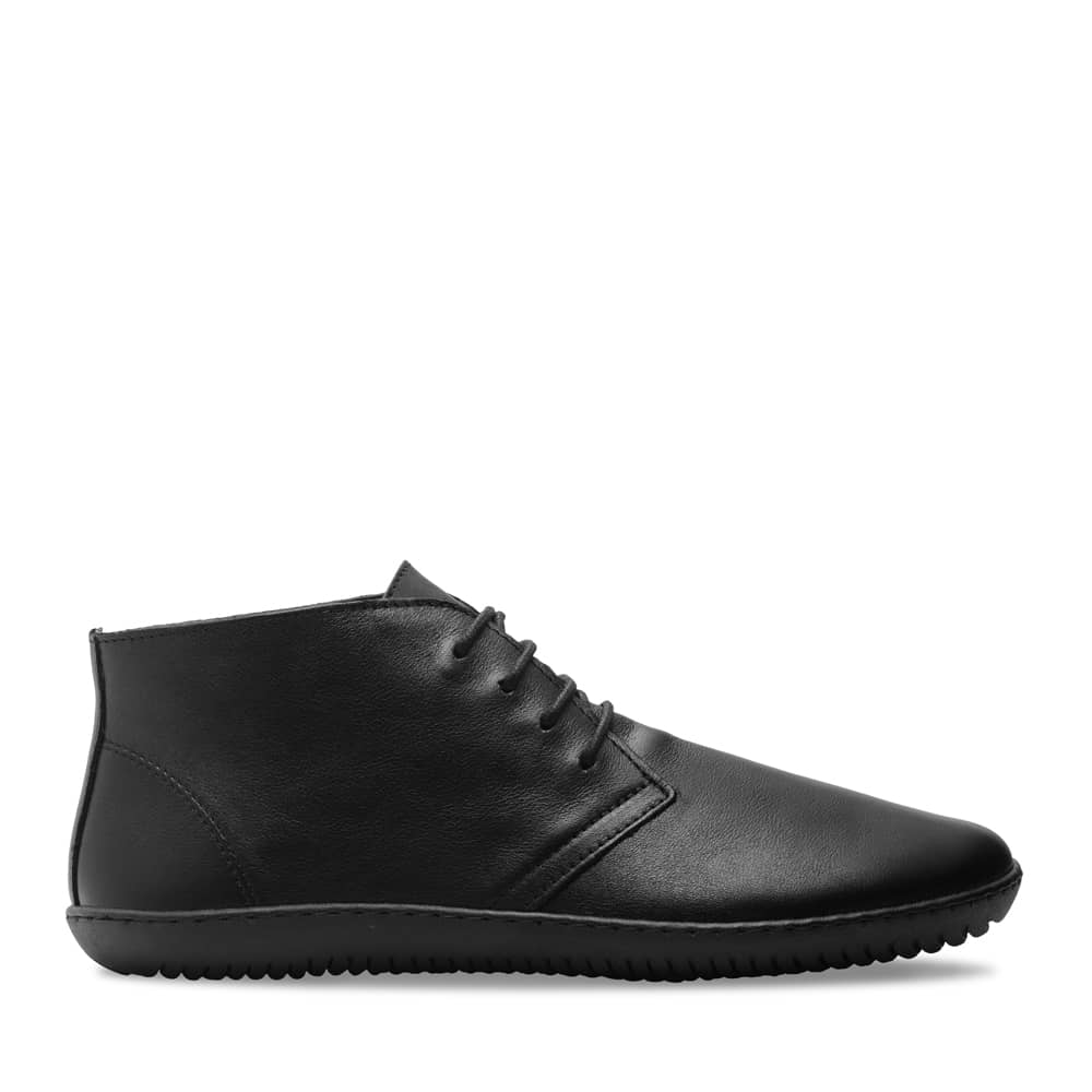 Black leather ankle boots with a sleek design, featuring a rounded toe and three eyelets for laces, set on a flexible rubber sole.