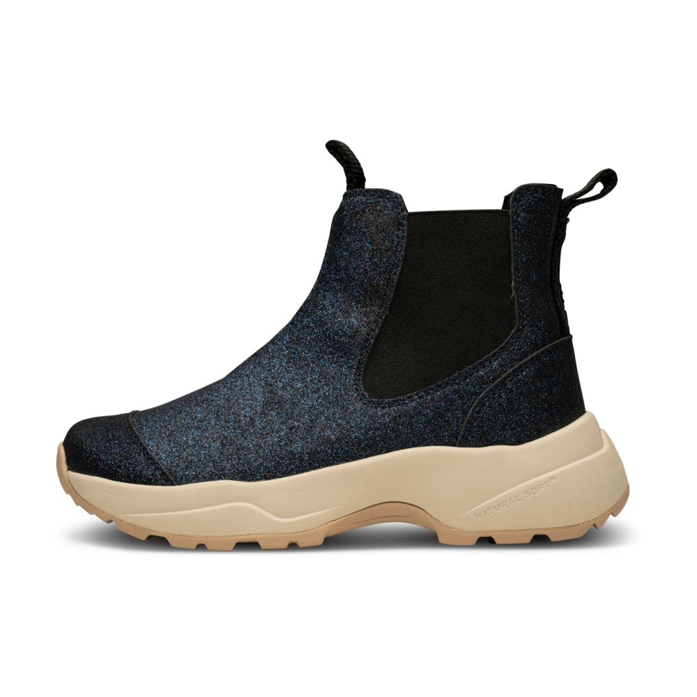 Women's Woden Silje Glitter boots featuring a dark blue glitter upper, black elastic side panels, and a chunky beige sole for a stylish and comfortable look.
