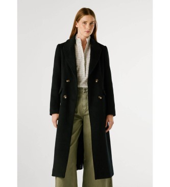 Black cotton long coat by Pepe Jeans for women, featuring a double-breasted design, notched lapels, and a tailored fit, styled with a white shirt and wide-leg green pants.