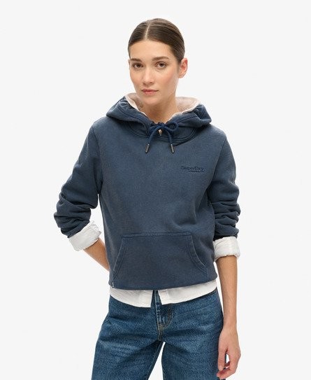 Navy half-brushed hoodie featuring a drawstring hood, front pocket, and subtle Superdry logo on the chest, styled with rolled sleeves over a white shirt.