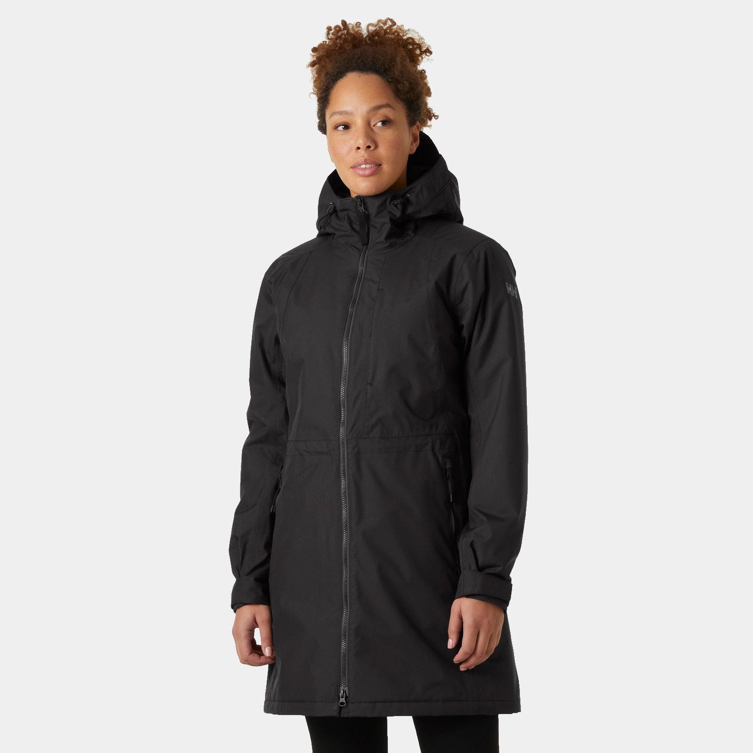 Women's long black hooded waterproof jacket by Helly Hansen, featuring a zip front, adjustable hood, and a sleek, insulated design for warmth and protection.