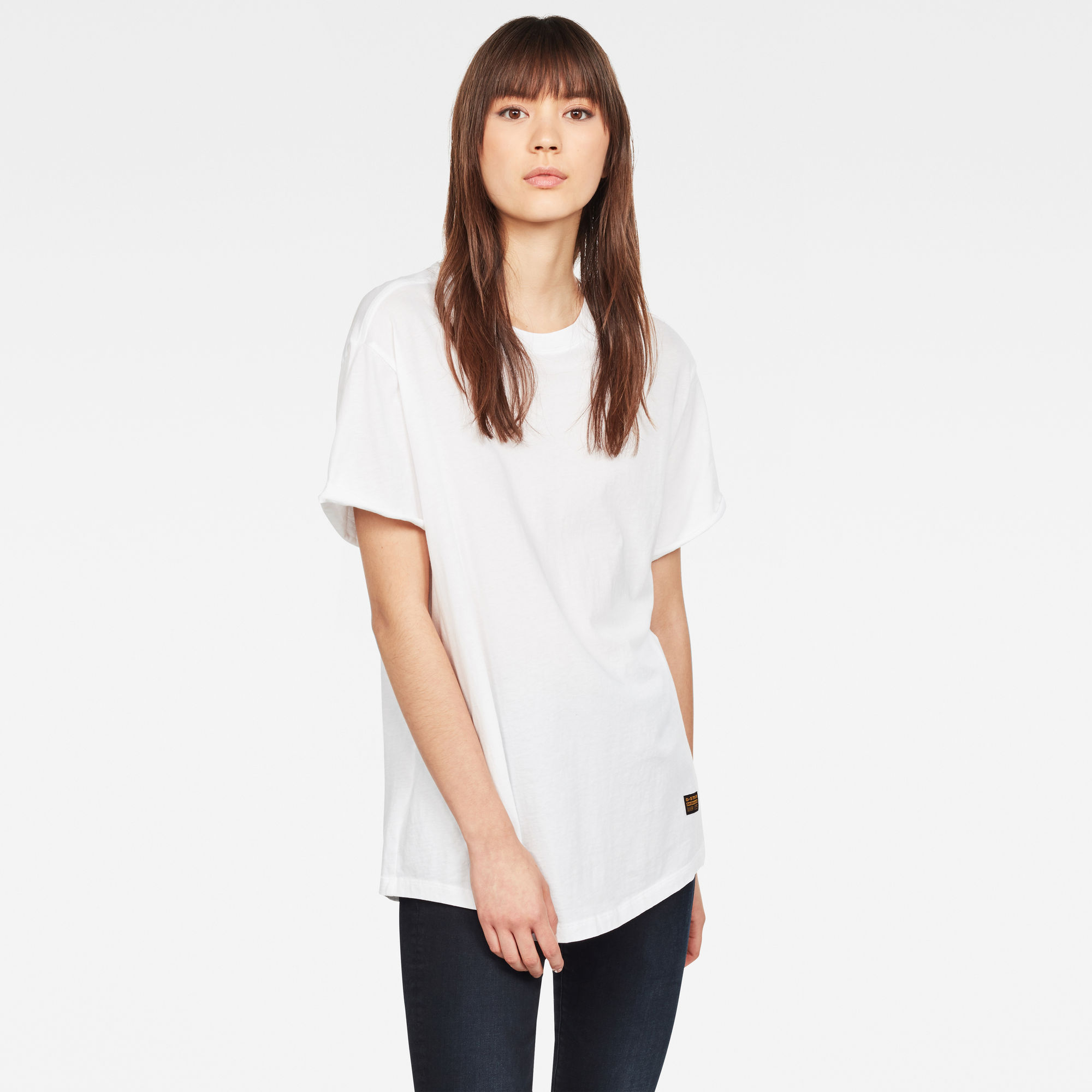 White loose-fitting T-shirt for women by G-Star, featuring short sleeves, a round neckline, and a subtle logo tag at the hem, made from soft cotton material.