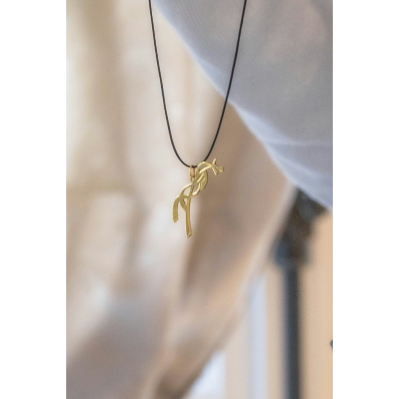 Gold-toned pendant shaped like a horse, hanging from a black cord necklace, featuring elegant curves and a minimalist design.