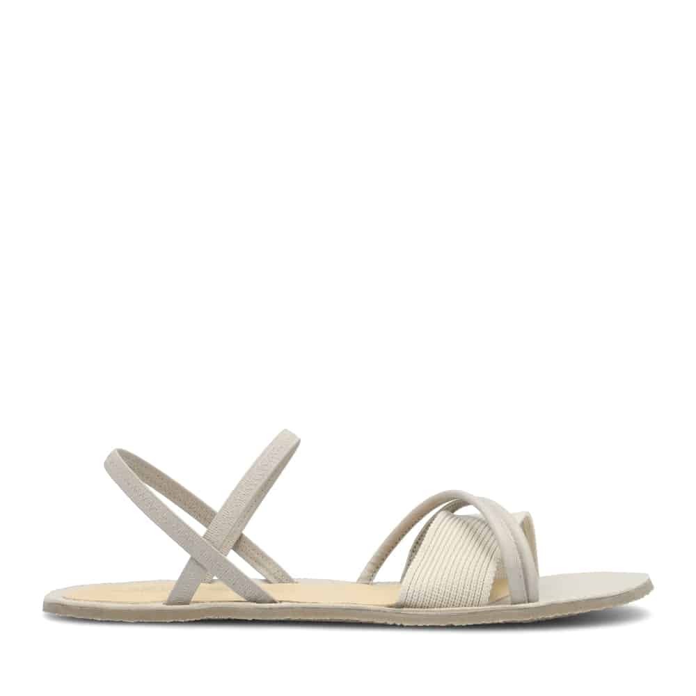 Light gray women's sandals with a minimalist design, featuring two crisscross straps and a soft elastic band for comfort, set on a flat sole.