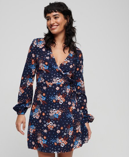 Navy short wrap dress with vibrant floral print, long sleeves, and a deep V-neckline, made from lightweight fabric, perfect for a stylish summer look.