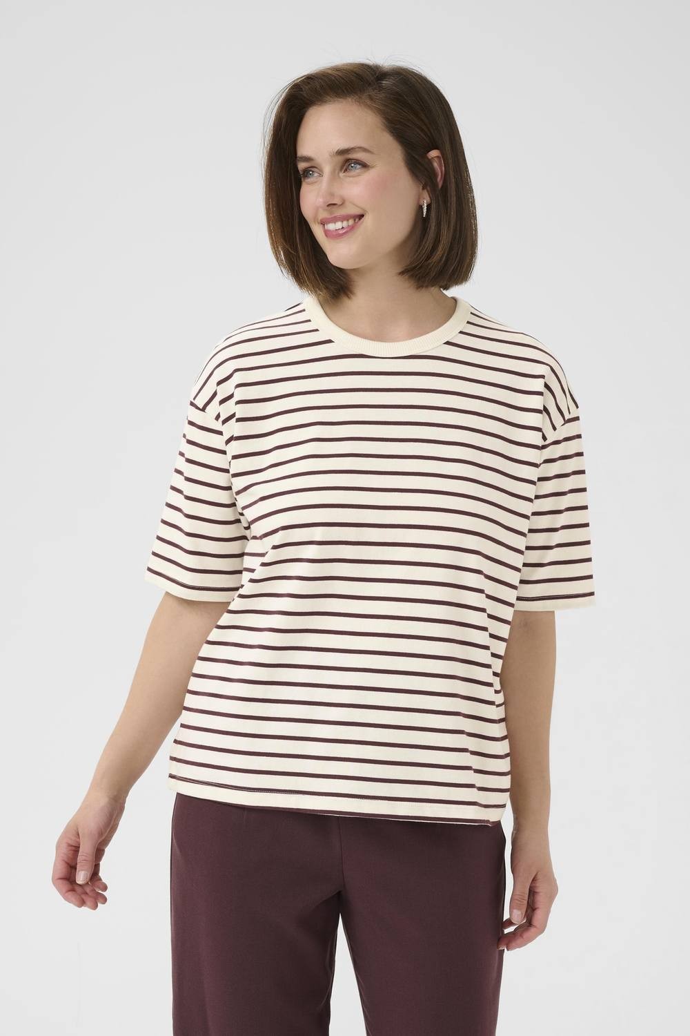 Maroon and cream striped casual fit T-shirt by Kaffe, featuring short sleeves and a relaxed neckline, displayed on a smiling model.