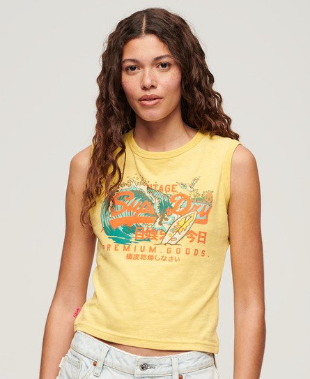 Yellow sleeveless tank top featuring the Superdry LA vintage logo in vibrant orange and teal, made from soft cotton fabric with a relaxed fit.