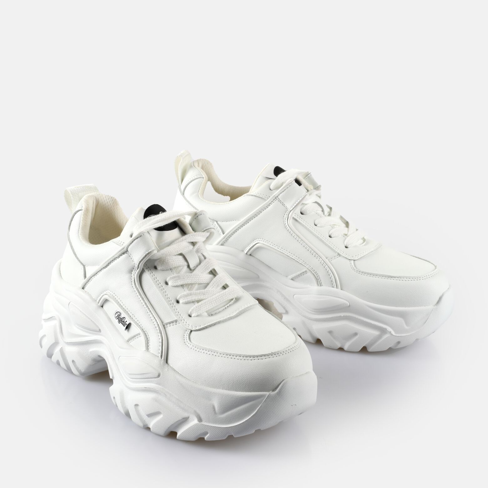 White chunky women's trainers with a thick sole, featuring a lace-up design, padded collar, and subtle branding on the side.