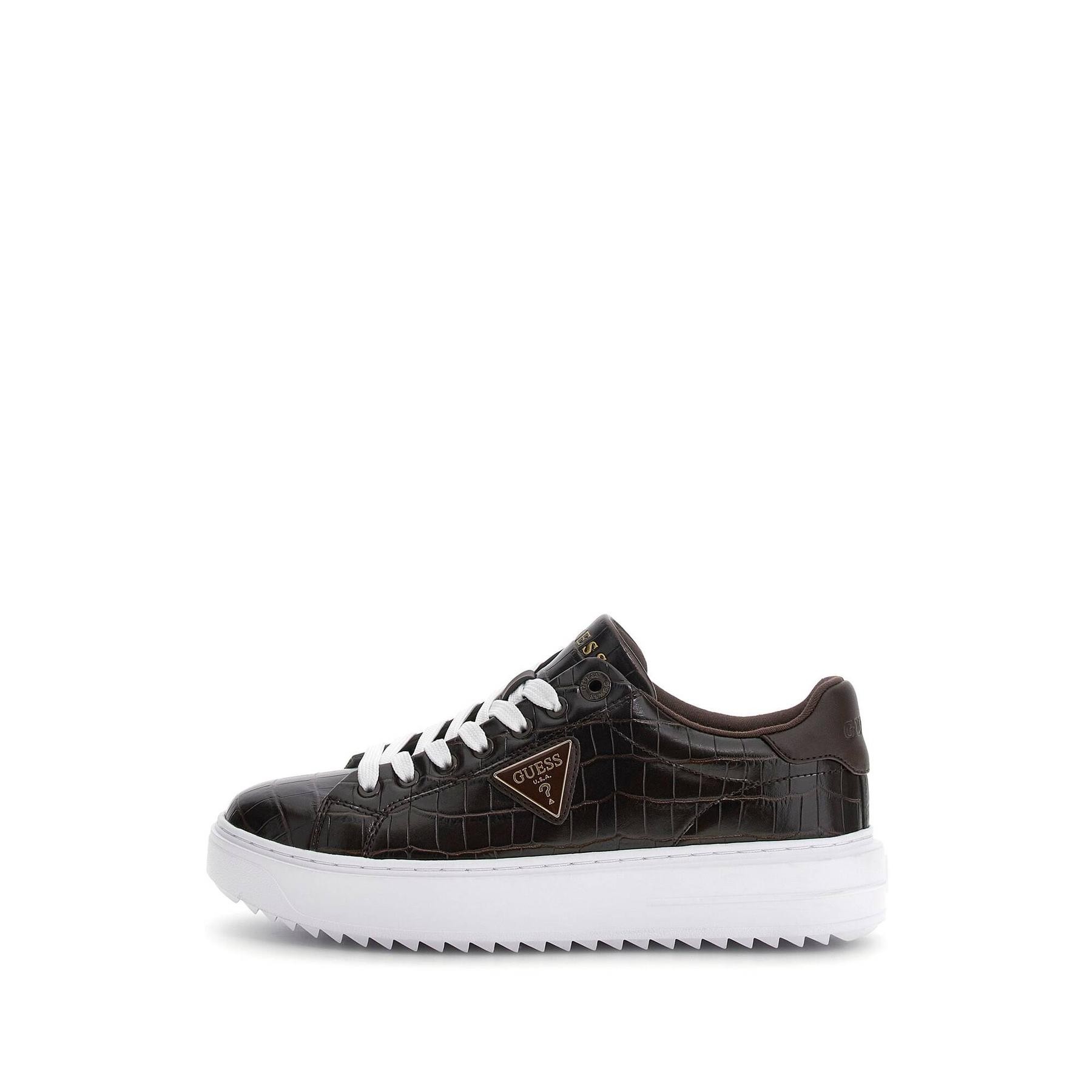 Black crocodile-embossed leather women's trainers with white rubber sole, lace-up design, and gold Guess logo on the side.