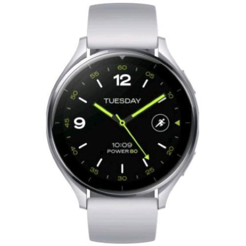Silver smartwatch with a round face, black dial, luminous green accents, and a light gray silicone strap, displaying the day and time.