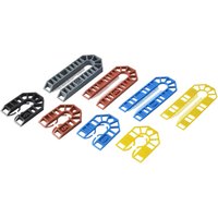 Assorted colored plastic shims in U-shape, including red, blue, yellow, and black, for leveling and spacing.