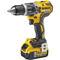 Yellow and black DeWalt 18V XR brushless combi drill with 5Ah battery and ergonomic grip.
