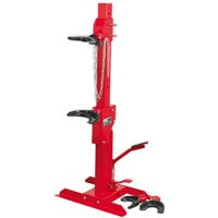 Red Sealey RE231 hydraulic coil spring compressor with foot pedal, dual clamps, and sturdy base.