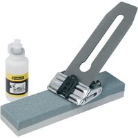 Stanley sharpening system with honing guide, gray sharpening stone, and lubricant bottle.