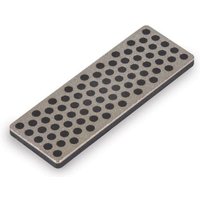 Rectangular Trend FastTrack preparation stone with black circular holes on a silver surface.