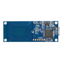 Blue circuit board with a rectangular shape, featuring an integrated chip, various electronic components, and a connector on one end.