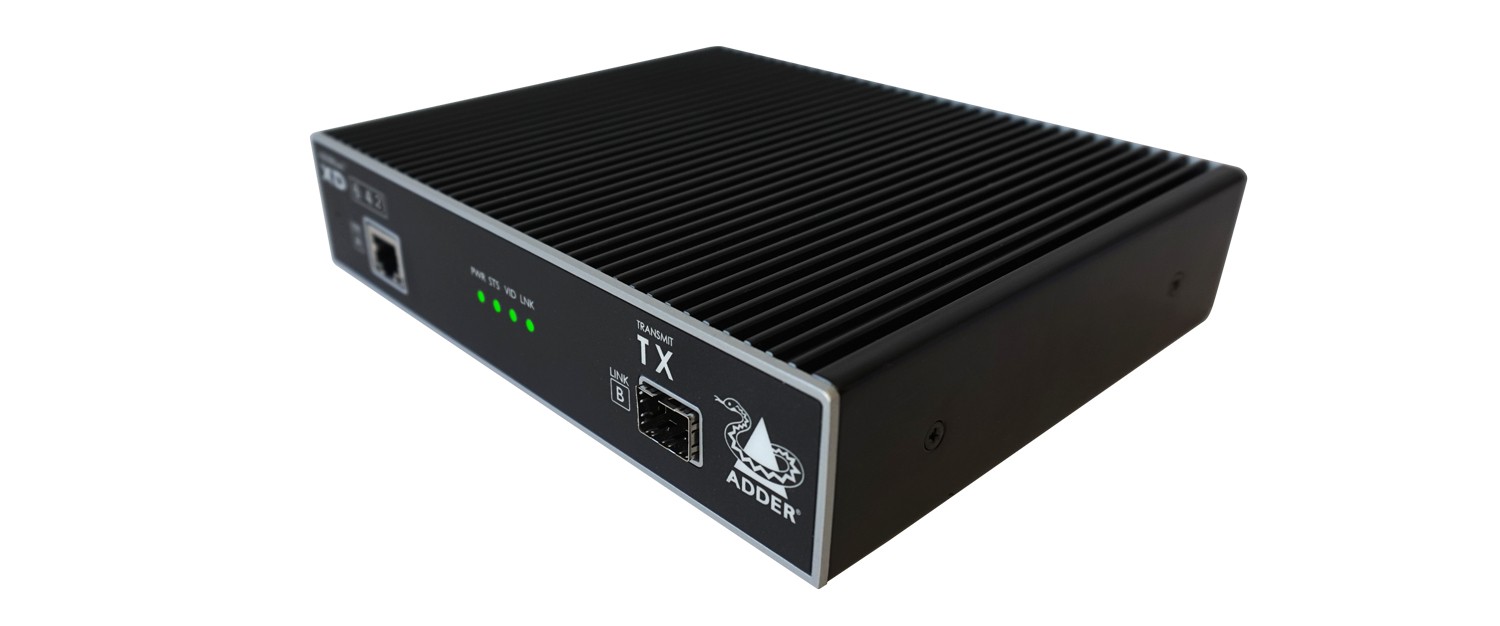 Black metal KVM extender transmitter with ribbed surface, featuring a TX indicator, Ethernet port, and Adder logo on the side.