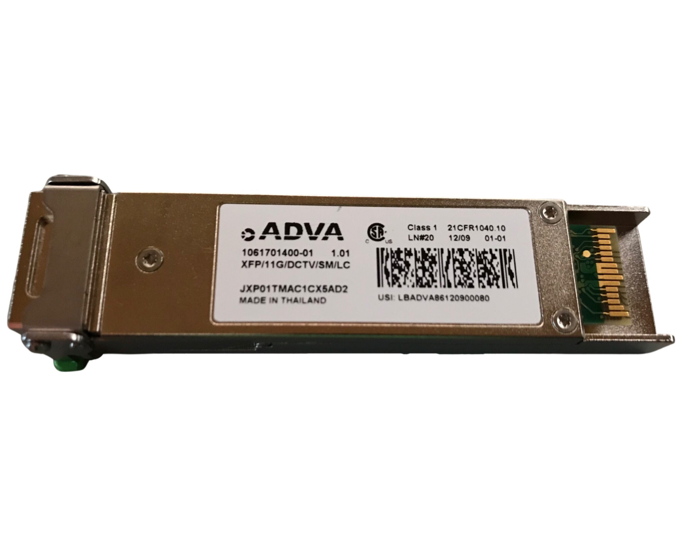 Silver metal XFP transceiver module with a green LED indicator, featuring a label with the ADVA logo, model number, and barcode, designed for 10GBase-DWDM applications.