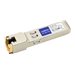 SFP-1GE-T-AO network transceiver module in beige plastic housing with gold-plated connectors, featuring a label with model information and ports for network connectivity.