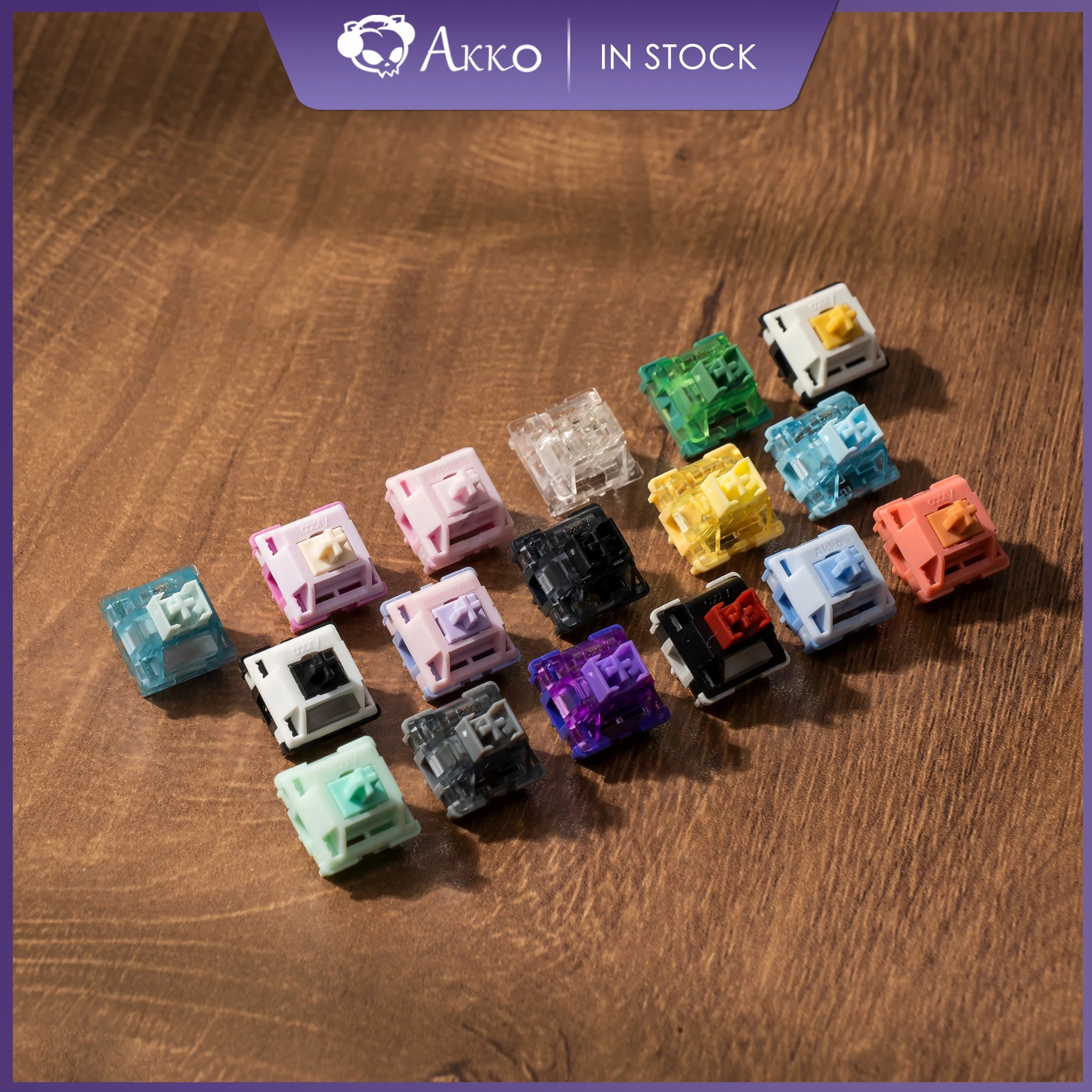 A collection of 90 Akko mechanical switches in various colors including clear, black, purple, yellow, and pastel shades, showcasing different key features and designs.