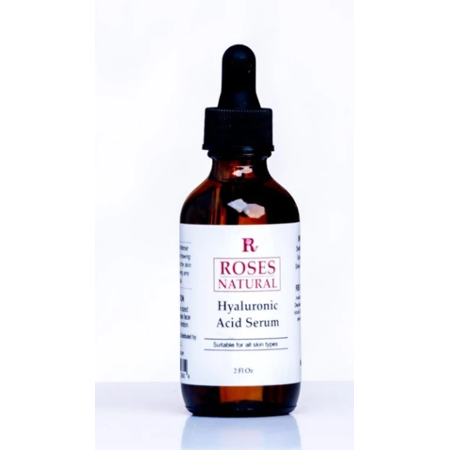 Brown glass dropper bottle with a black pipette cap, labeled "Roses Natural Hyaluronic Acid Serum," 2 fl oz, featuring white and red text on a white background.