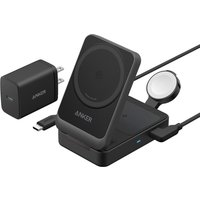 Black Anker wireless charger with USB port, phone stand, and smartwatch dock, includes wall adapter and cable.
