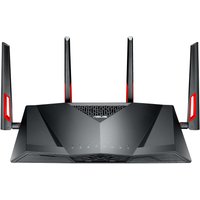 Black ASUS DSL-AC88U wireless router with four antennas, angular design, and red accents on the sides.