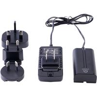 Black Atomos ATOMDCA001 monitor mount accessory with a compact design, featuring interchangeable power plugs and a sturdy build for secure mounting.