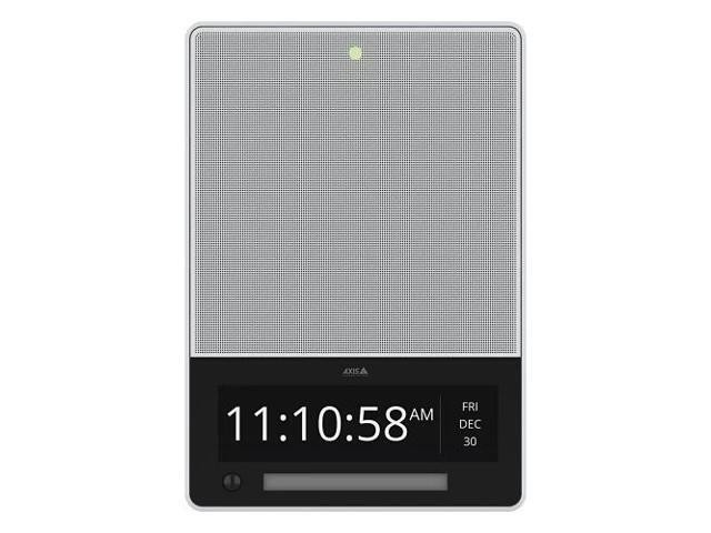 White rectangular device with a mesh speaker grille, digital clock display showing time and date, and a green indicator light at the top.