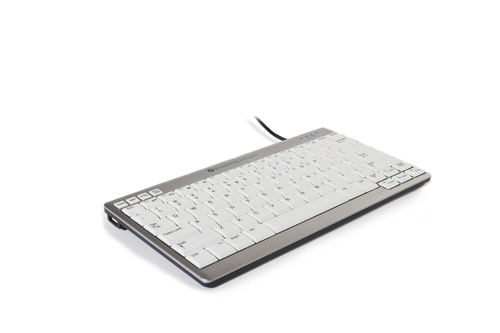 Compact wired keyboard in silver and white, featuring low-profile keys, a sleek design, and a USB connection, ideal for ergonomic use.