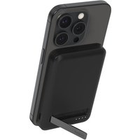 Black Belkin BoostCharge Pro wireless charger with stand, supporting a smartphone in an upright position.