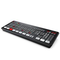 Blackmagic Design ATEM Mini Extreme features a sleek black design with numerous buttons, including red and white keys, for video switching and live streaming control.