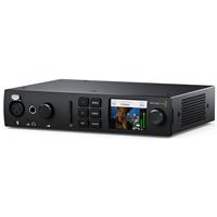 Blackmagic Design UltraStudio 4K Mini is a sleek black video capturing device with a compact design, featuring a display screen, various input/output ports, and control buttons on the front.