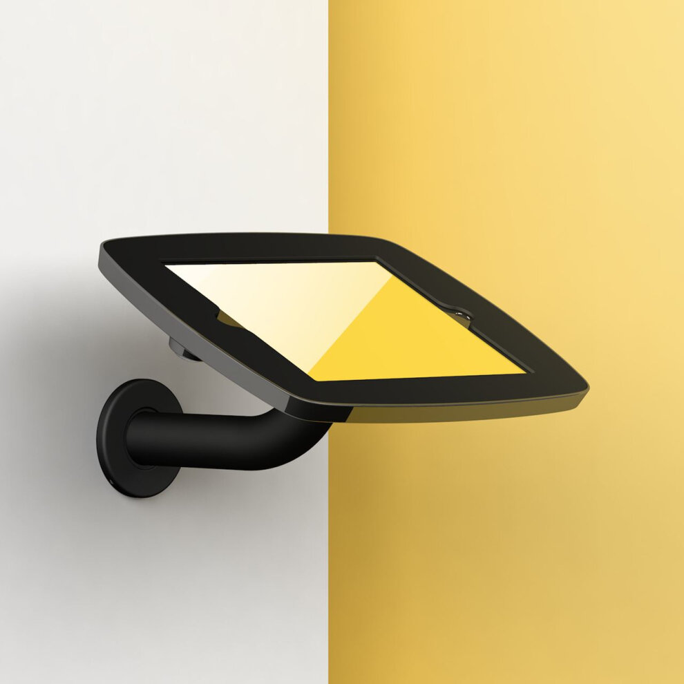 Black Bouncepad Branch mount for Apple iPad 6th Gen, featuring a sleek, angled design with a sturdy arm, securely holding the tablet against a split yellow and white background.