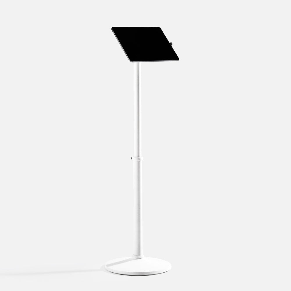 White Bouncepad Core Elevate tablet mount featuring a sleek design with a sturdy base and adjustable height, holding a tablet at an angle for easy viewing.