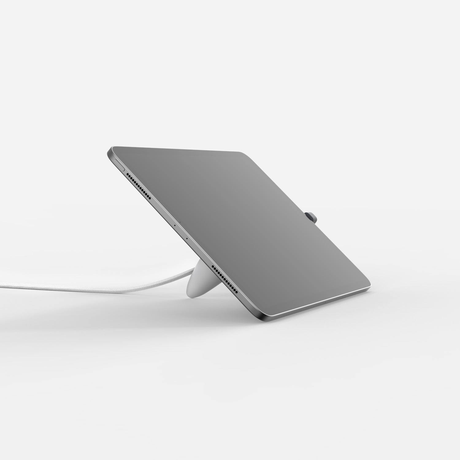 White Bouncepad Core Lounge stand with a sleek design, featuring an adjustable angle for USB-C tablets, and a cable management system for tidy use.