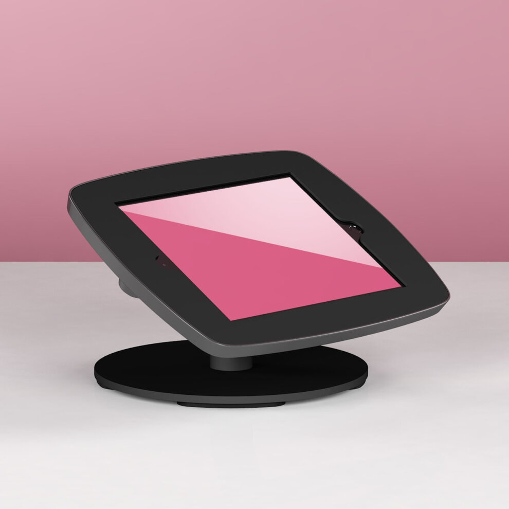 Black Bouncepad Counter stand for Samsung Galaxy Tab A 10.1 (2019) with a sleek design, featuring a tiltable screen and a sturdy base, set against a pink background.