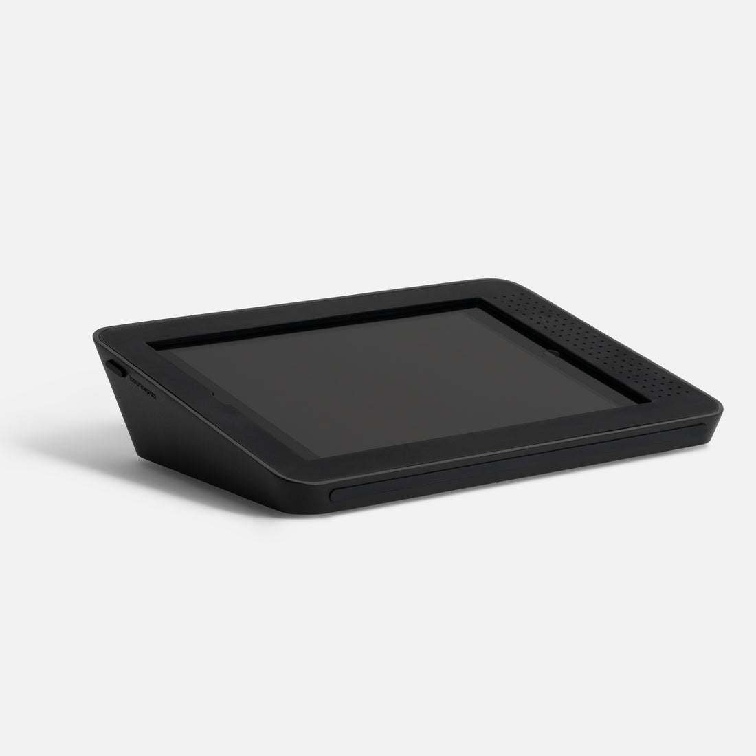 Black, angled tablet stand designed for Apple iPad 7th, 8th, and 9th Gen, featuring a sleek, durable material with ventilation holes and a secure slot for the device.