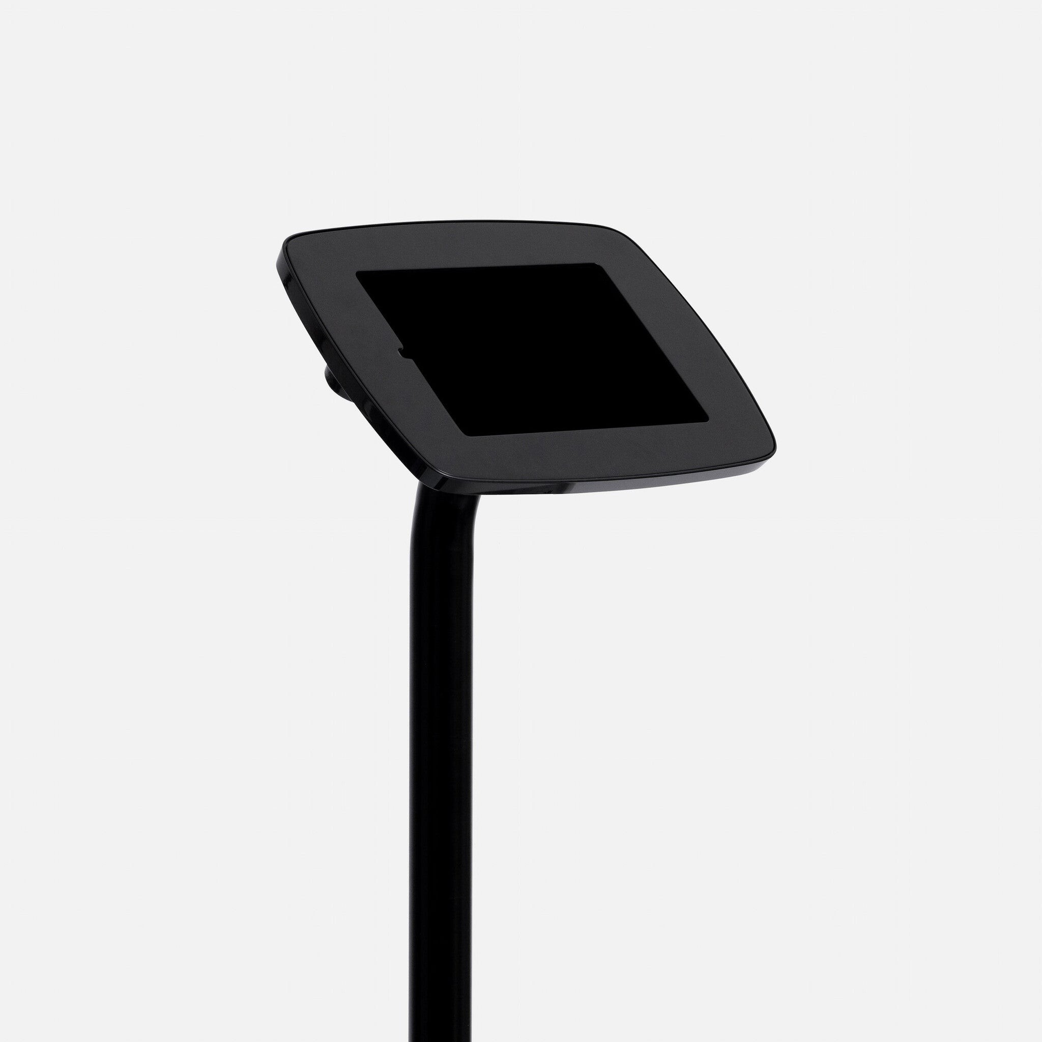 Black Bouncepad Original Elevate with a sleek, angled tablet holder mounted on a tall, sturdy black pole, featuring a USB cable for connectivity.