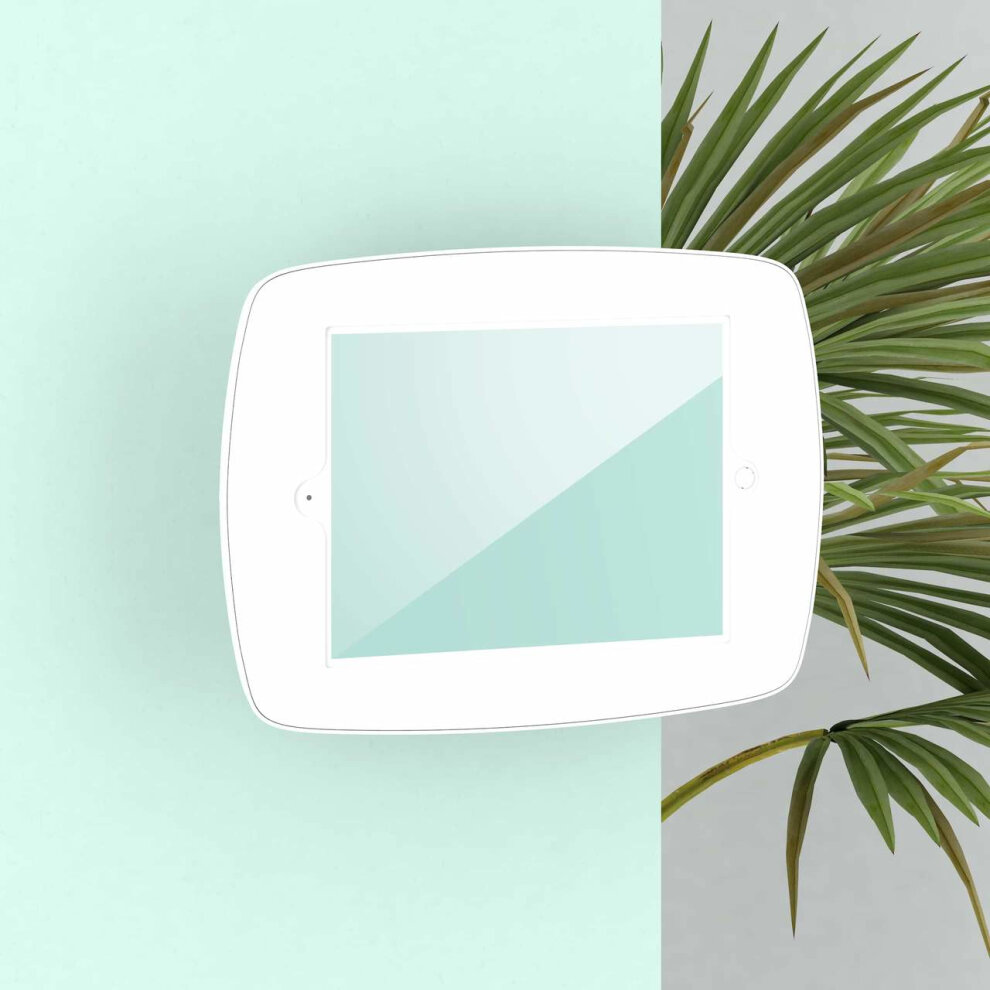 White Bouncepad VESA mount for Apple iPad Pro 12.9 (2015-2017) features a sleek design, smooth finish, and a secure tablet holder, positioned against a mint green wall.