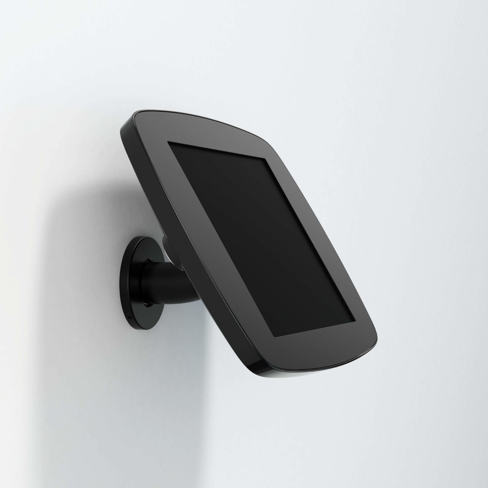 Black Bouncepad Wallmount for Apple iPad 7th Gen 10.2 (2019) securely mounted on a wall, featuring a sleek design and an angled display for easy viewing.
