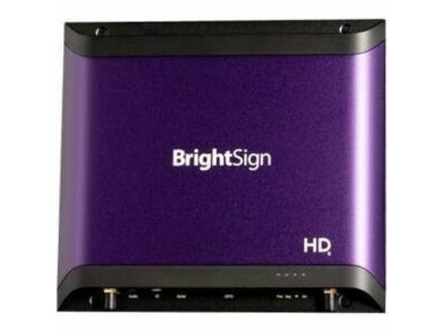 Brightsign HD1026 is a compact, purple media player with a sleek metallic finish, featuring the BrightSign logo prominently on the front and multiple ports on the back.