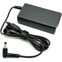 Black BTI 65W charger with 5.5mm x 2.5mm tip, includes coiled cable and UK power plug.