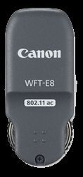 Canon WFT-E8B Wireless File Transmitter in gray, featuring a compact design, Canon branding, and connectivity options, ideal for wireless image transfer.
