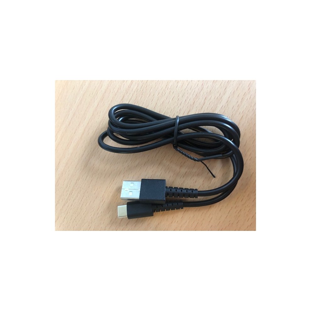 Black USB charging and syncing cable with a standard USB-A connector and a USB-C connector, coiled neatly on a wooden surface.