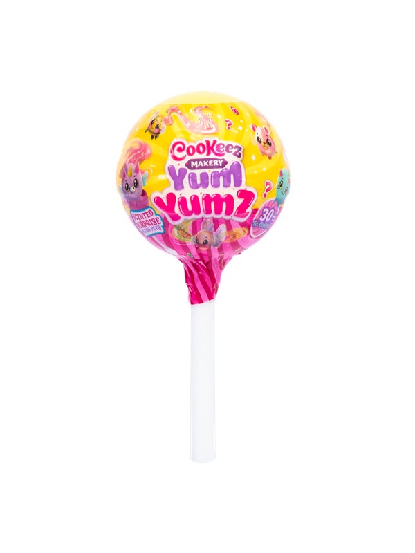 Bright yellow lollipop-shaped packaging featuring various cute characters, with a pink wrapper and white stick, labeled "Cookeez Makery Yum Yumz" and indicating a mystery soft toy inside.